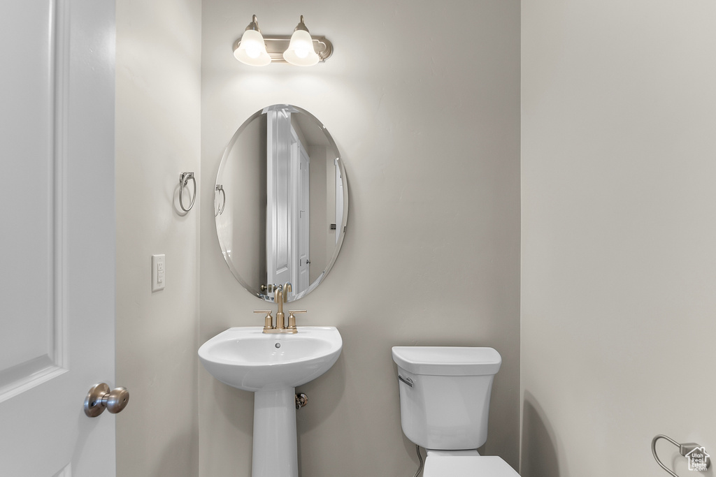Half bathroom featuring toilet
