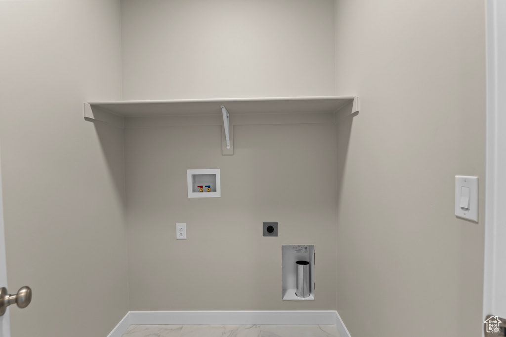 Washroom featuring marble look tiles, washer hookup, baseboards, and electric dryer hookup