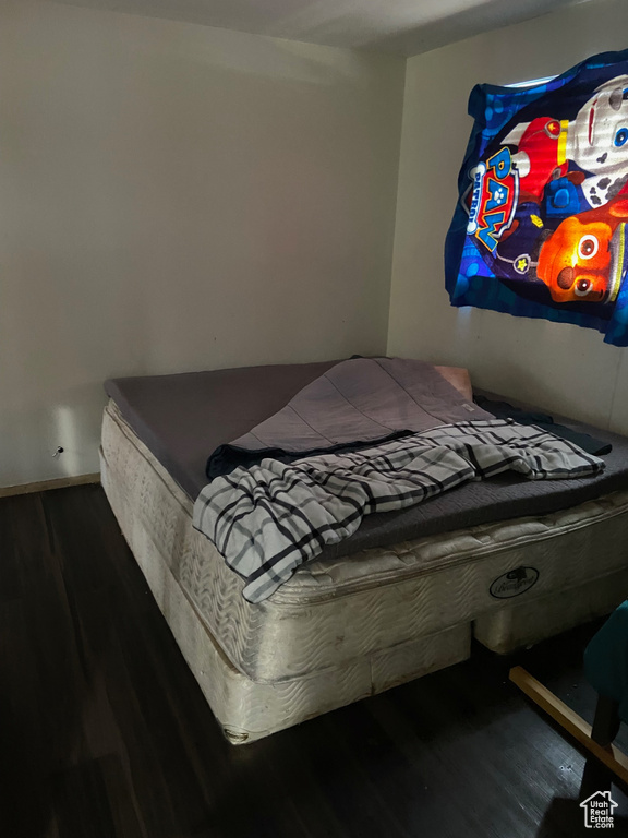 Bedroom featuring wood finished floors