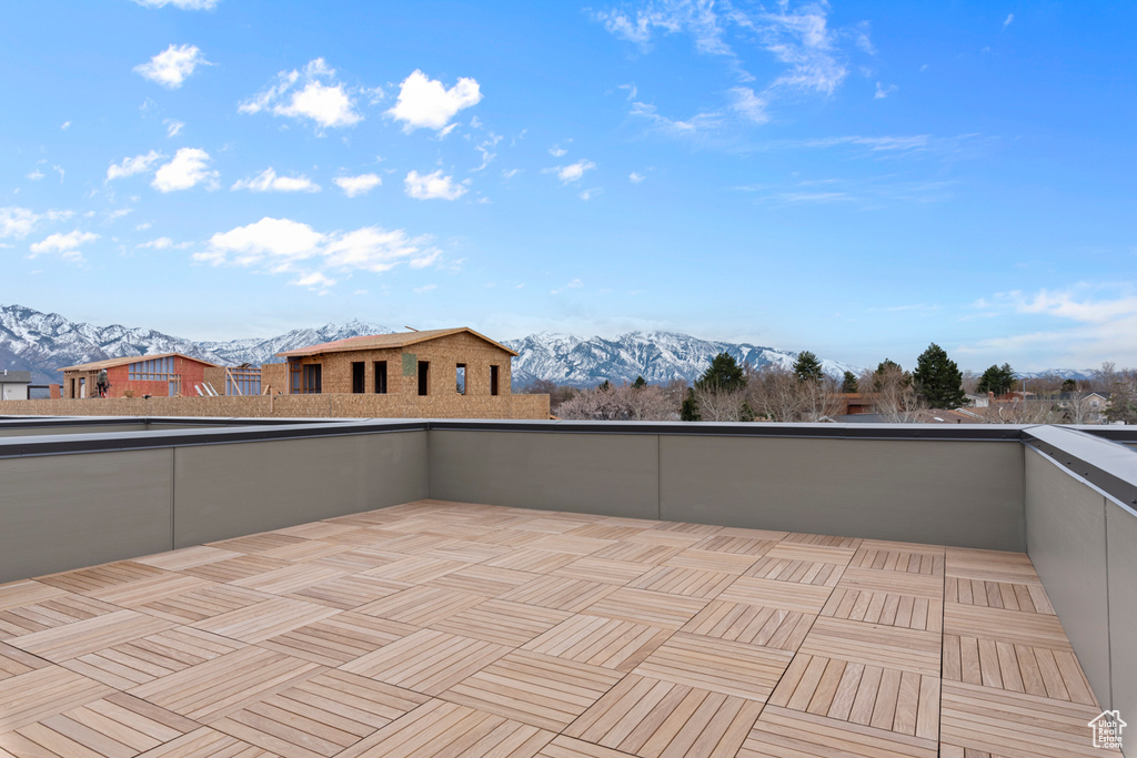 View of patio / terrace with a mountain view and a balcony
