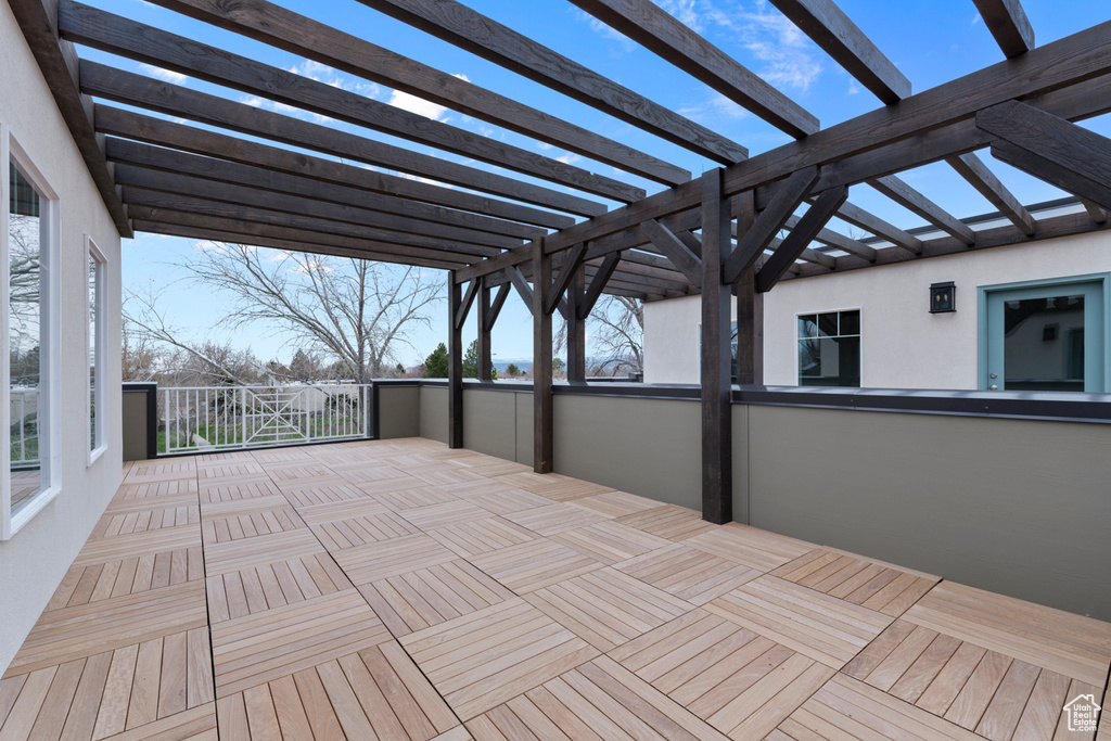 Wooden terrace featuring a pergola
