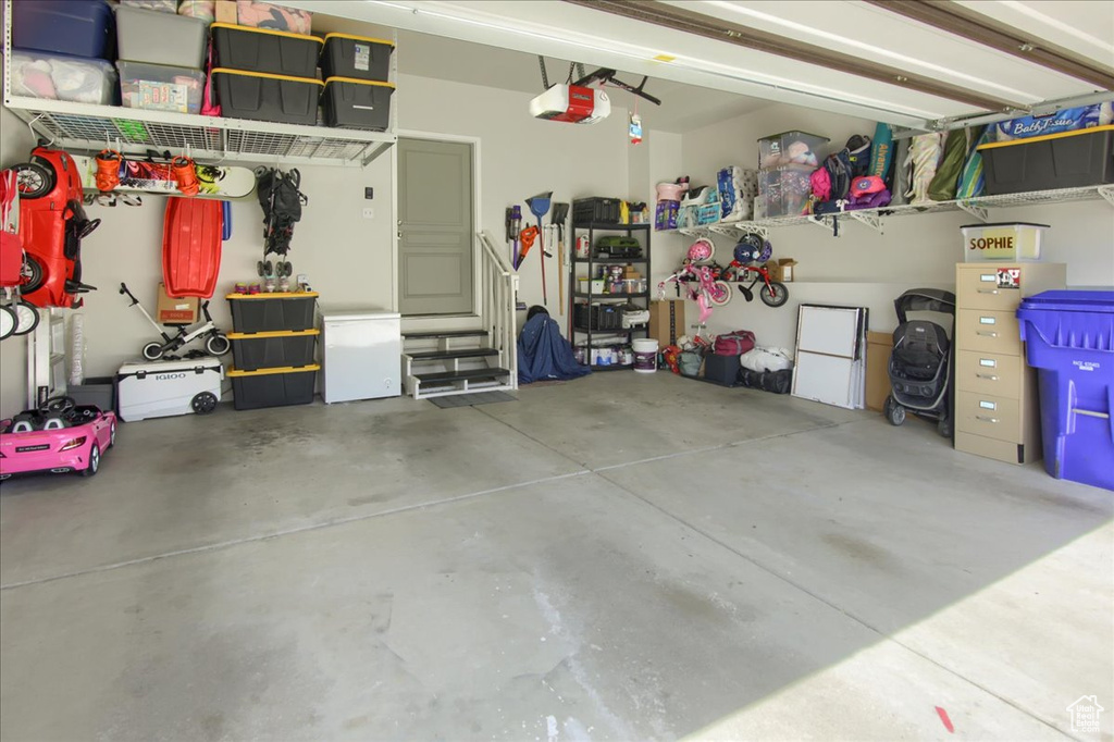 Garage featuring a garage door opener