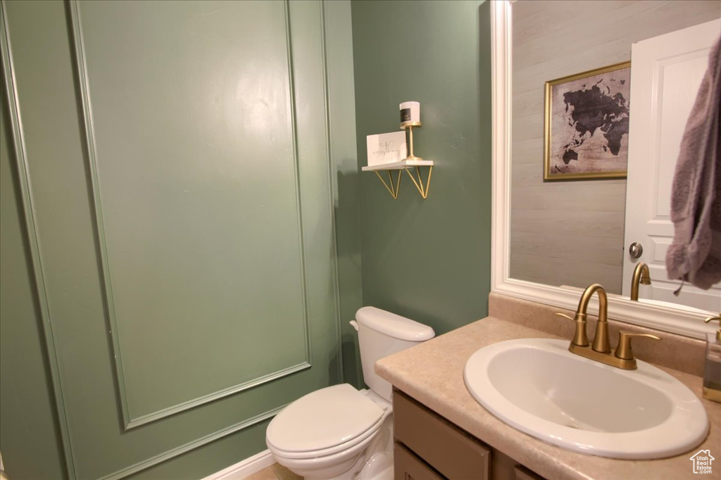 Bathroom featuring vanity and toilet