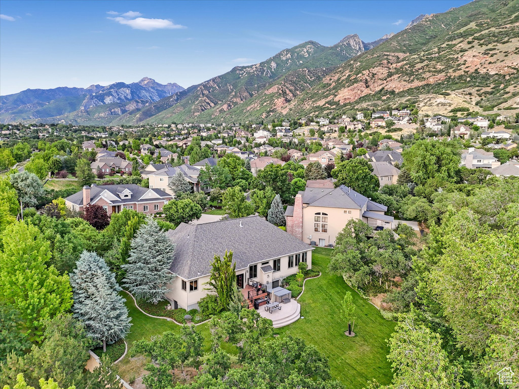Aerial view of property\'s location featuring mountains and nearby suburban area