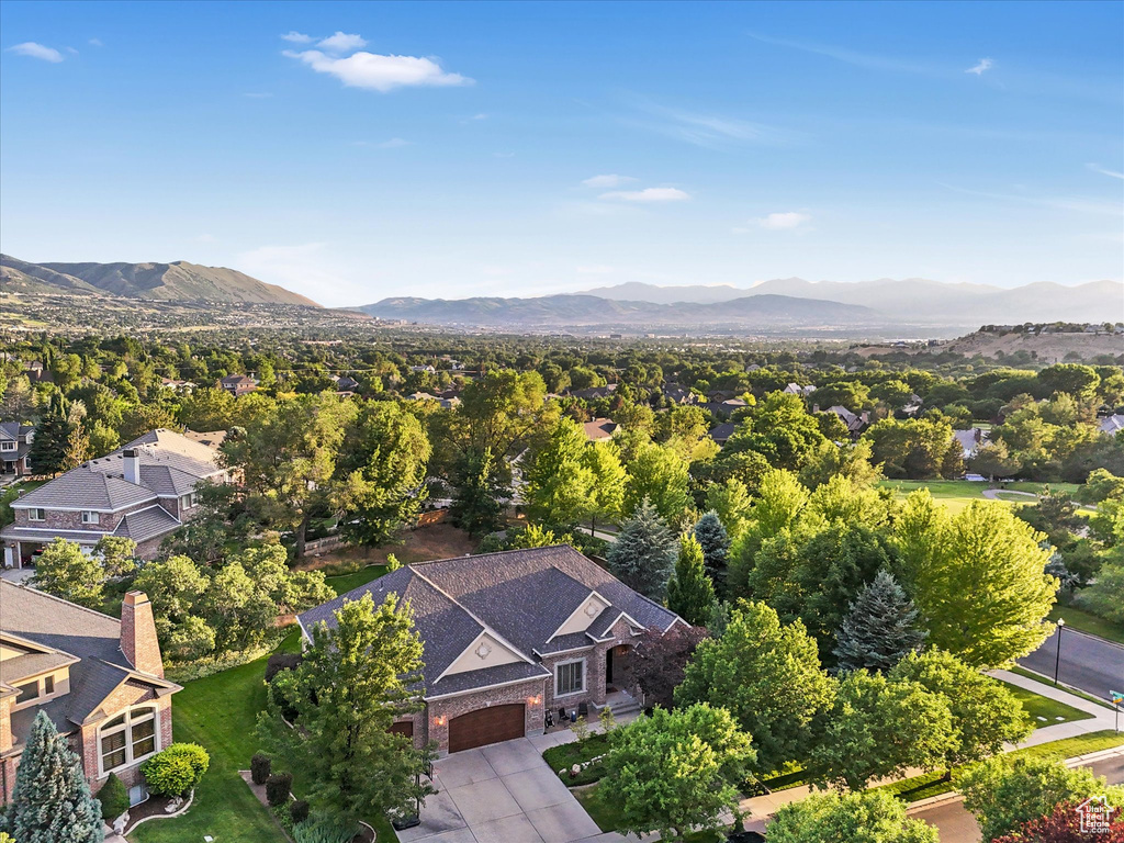 Aerial view of residential area featuring a mountainous background