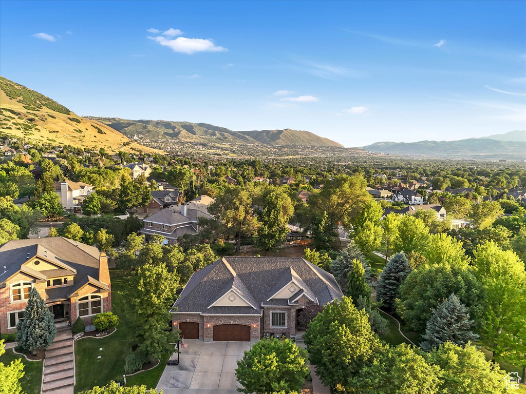 Aerial view of residential area with a mountainous background