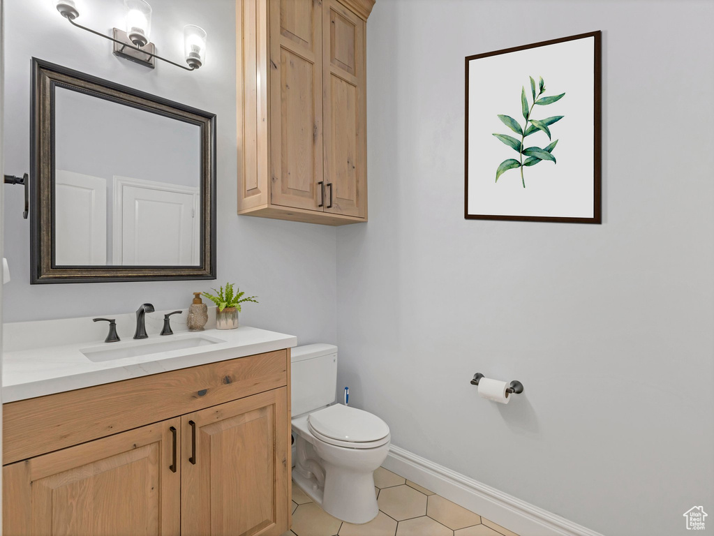 Bathroom with vanity and tile patterned floors