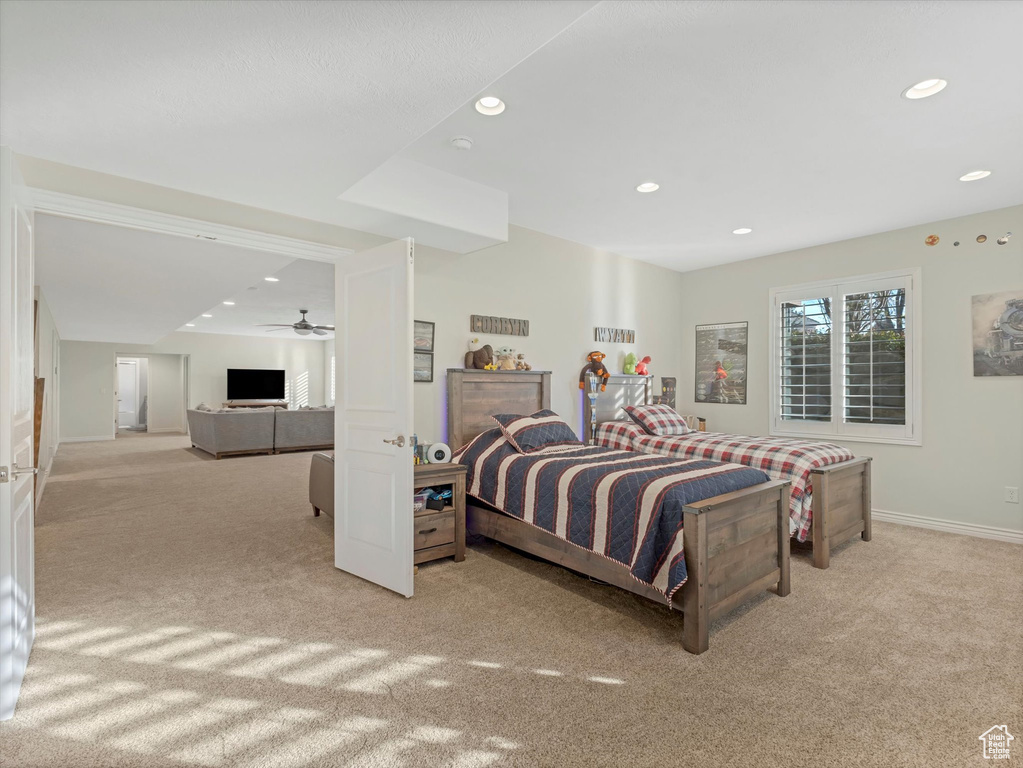 Bedroom with carpet floors, recessed lighting, and baseboards