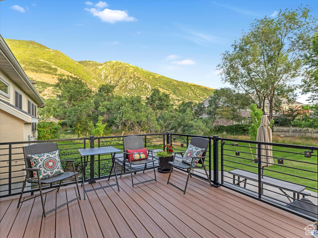 Wooden terrace featuring a mountain view