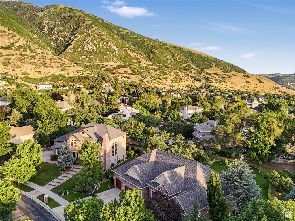 View of property location with a mountain backdrop and nearby suburban area