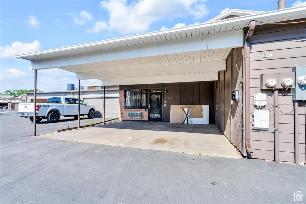 View of exterior entry featuring a carport