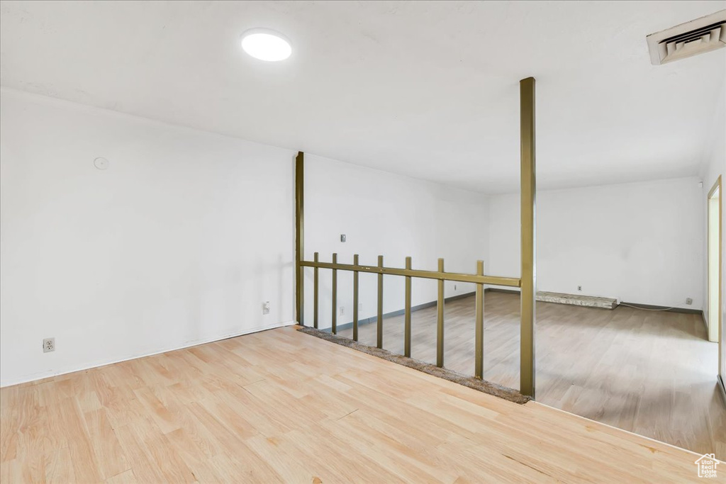 Unfurnished room featuring wood finished floors
