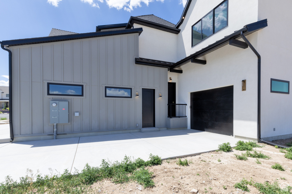 View of front of property with board and batten siding and stucco siding