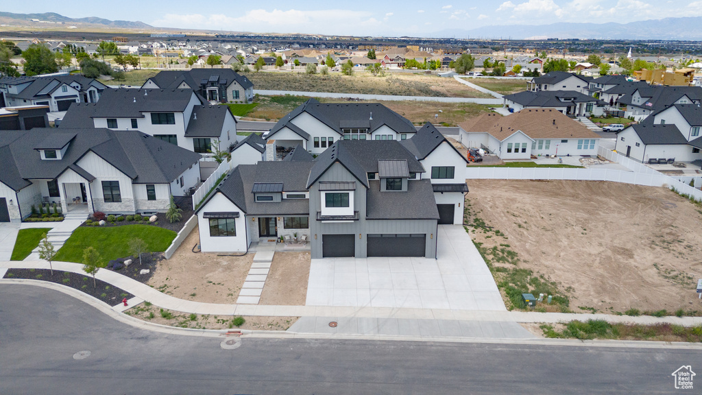 Aerial view of residential area with a mountainous background