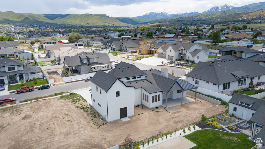 Aerial view of residential area with a mountainous background