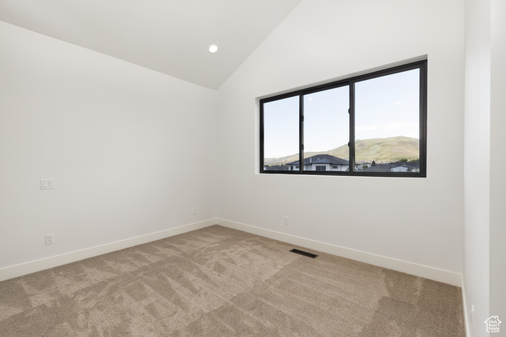 Unfurnished room with carpet floors, baseboards, high vaulted ceiling, and recessed lighting