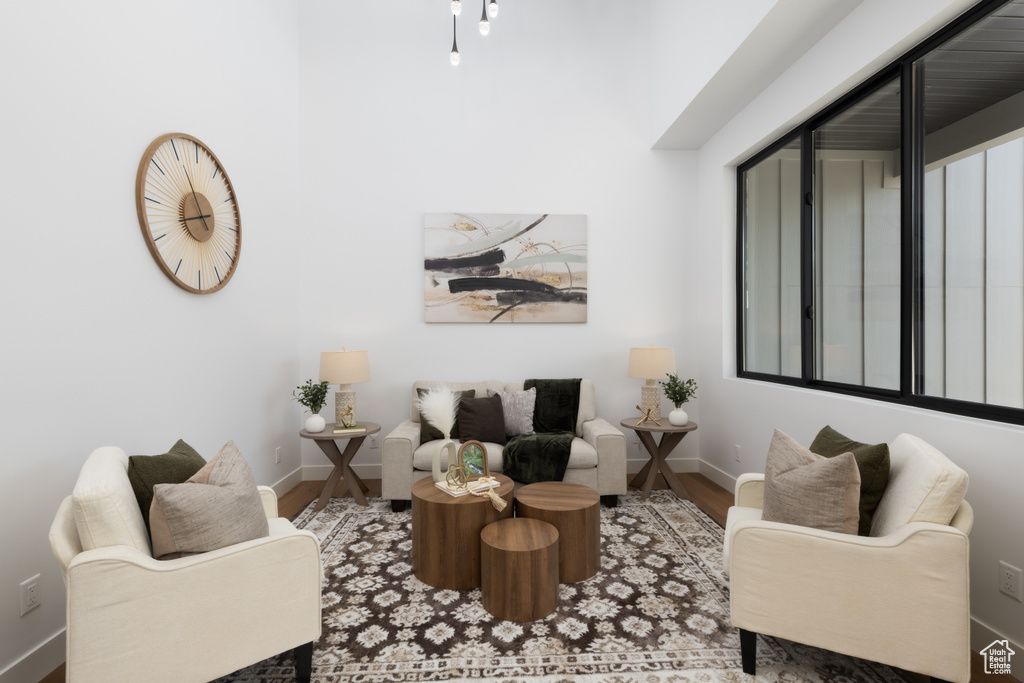 Living area featuring baseboards and wood finished floors