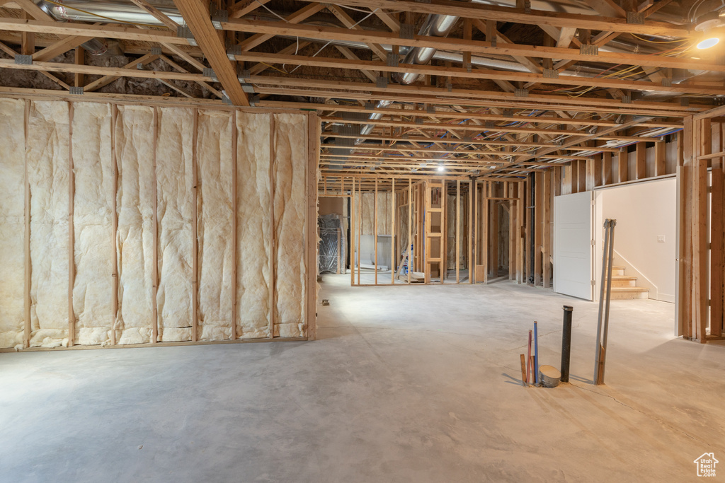 Unfinished basement with stairway