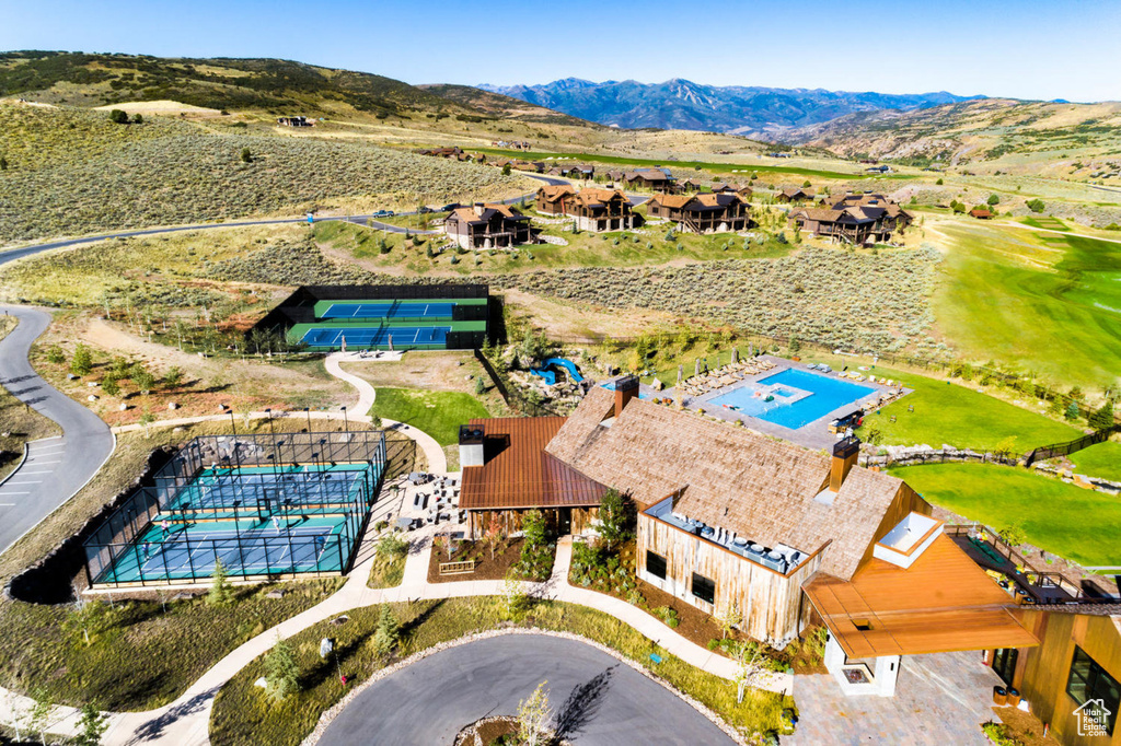 Bird's eye view of a mountain backdrop and a pool