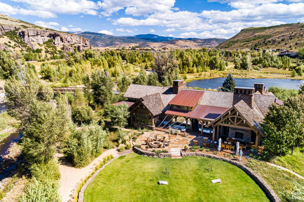 View of subject property featuring a water and mountain view