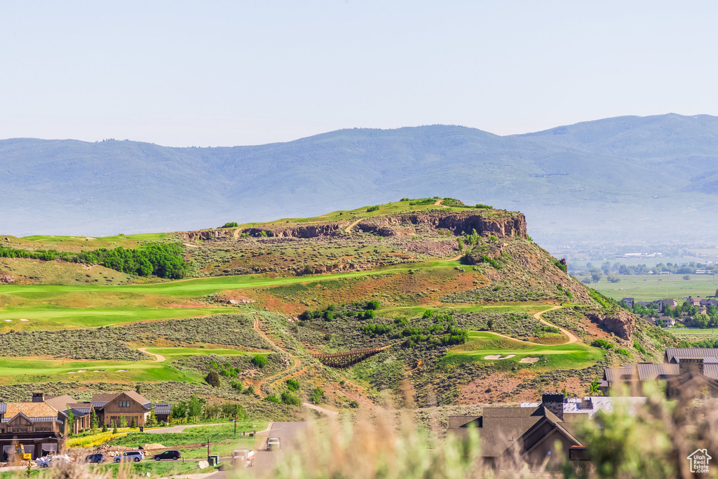 View of mountain background featuring a golf course