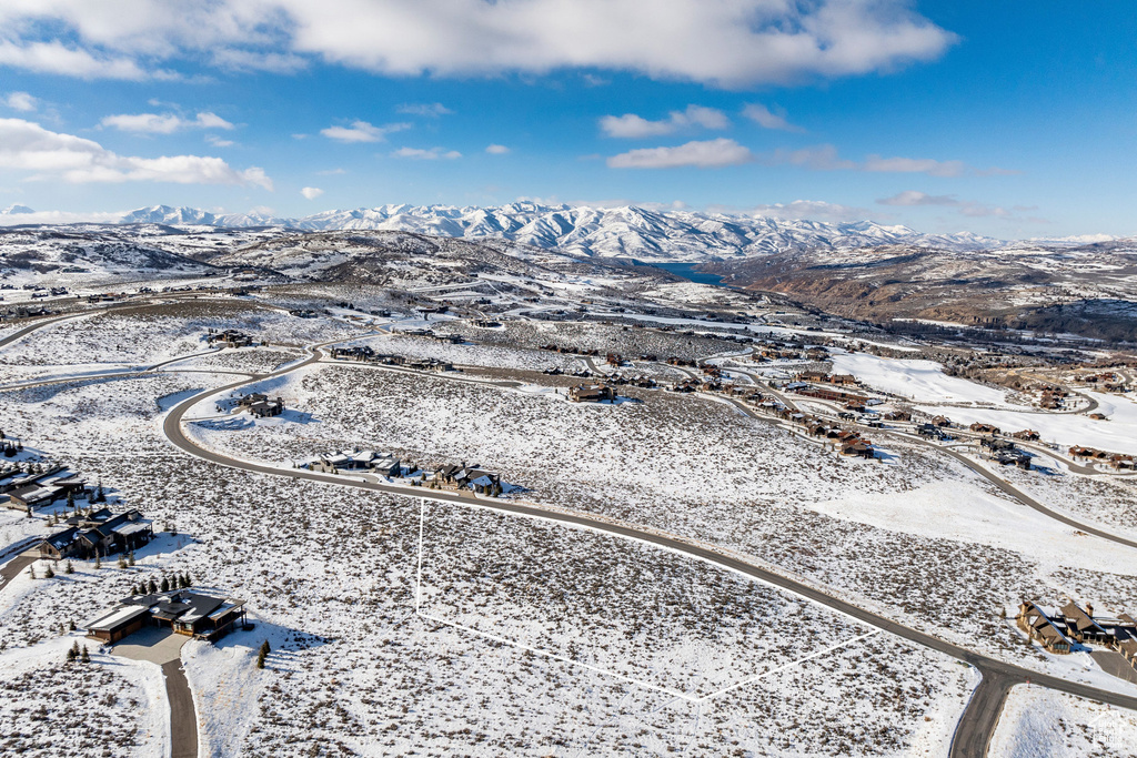 Snowy aerial view with a mountain view