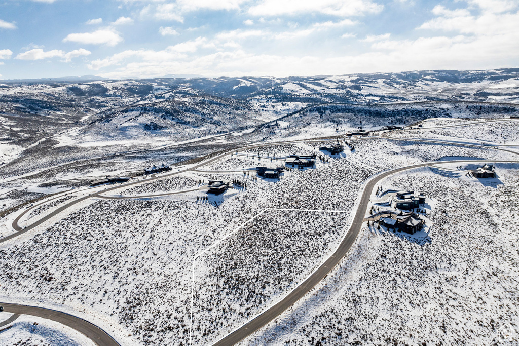 Snowy aerial view with a mountain view