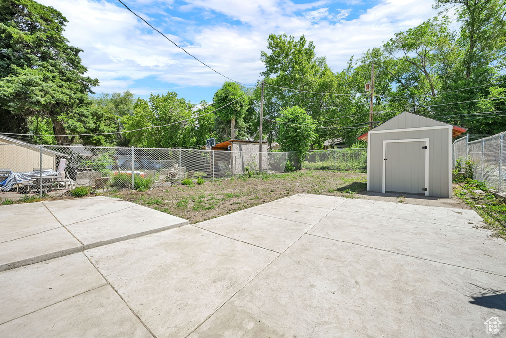 Fenced backyard with a patio area