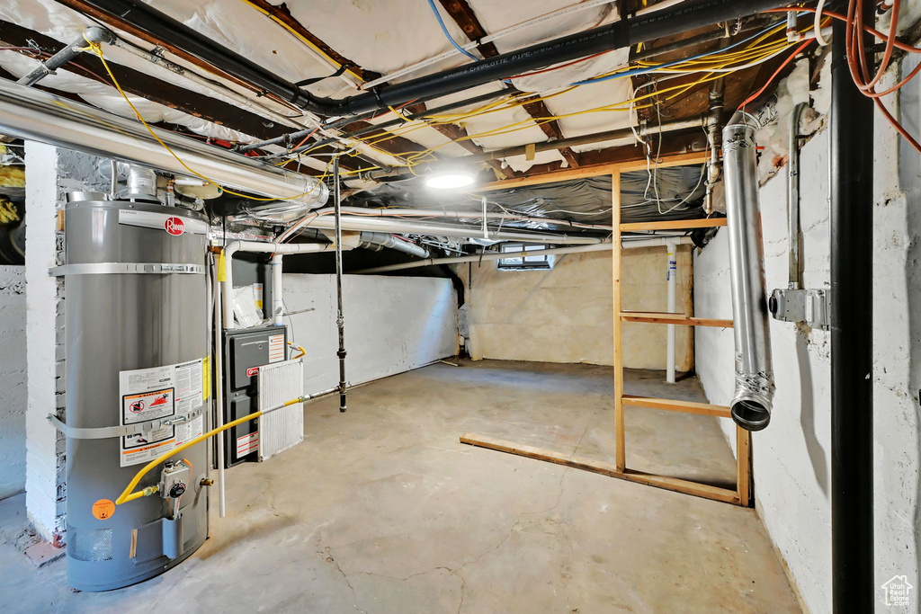 Unfinished below grade area with strapped water heater