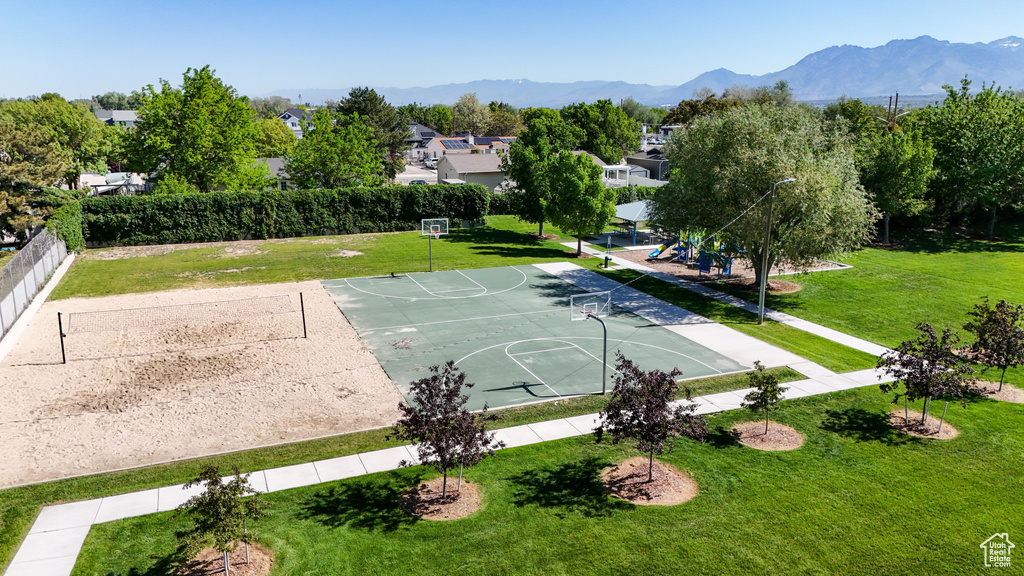 View of sport court featuring community basketball court, a yard, and a mountain view