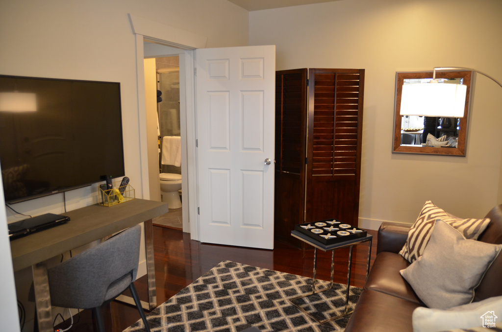 Office space with dark wood-style flooring