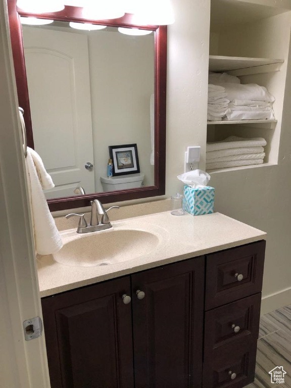 Half bathroom featuring vanity