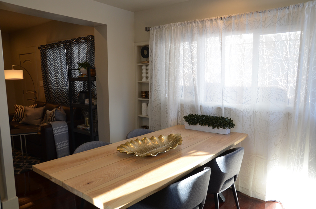 Dining area featuring dark wood-type flooring