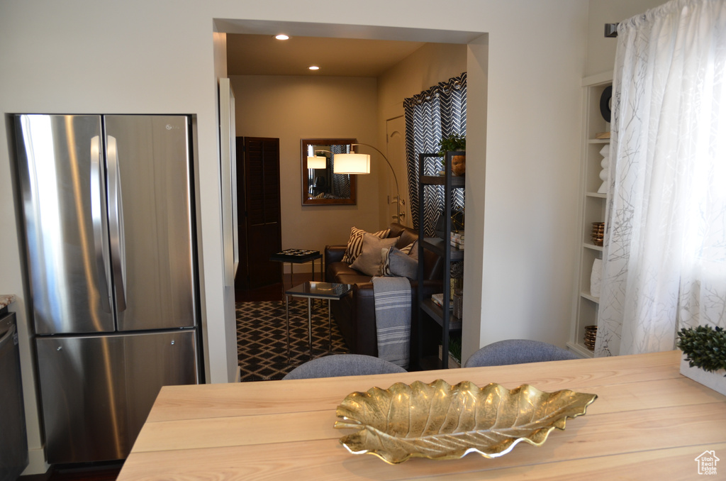 Dining room with built in shelves and recessed lighting