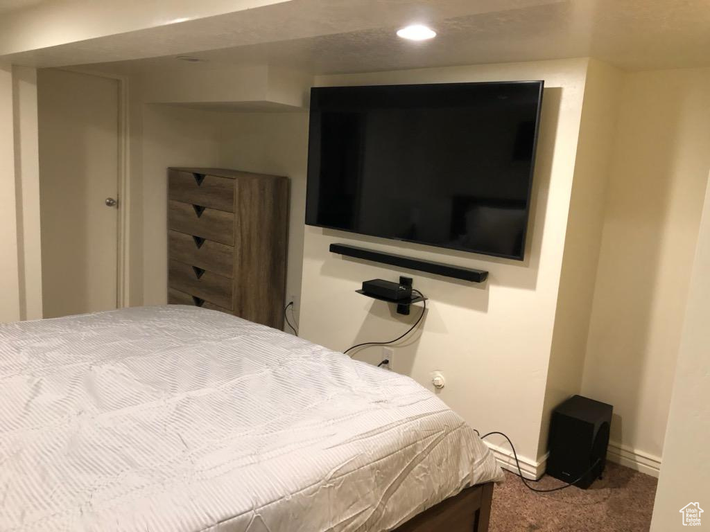 Carpeted bedroom with baseboards