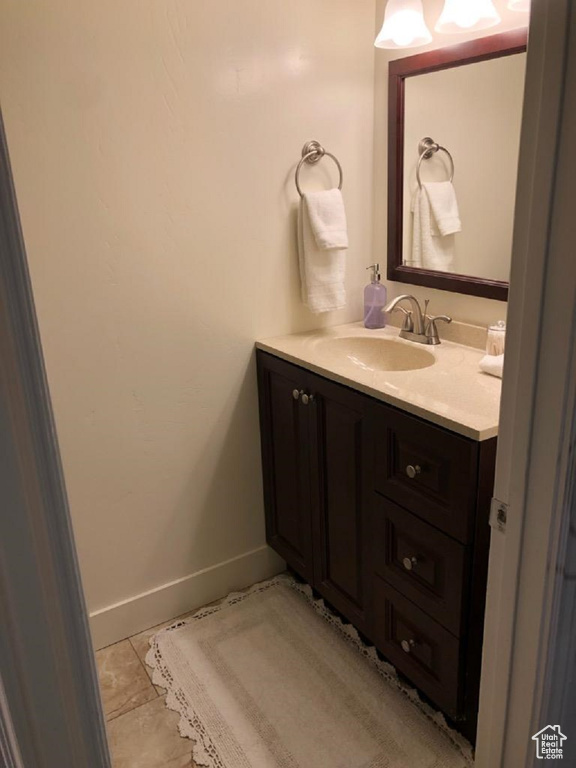 Bathroom with vanity and baseboards