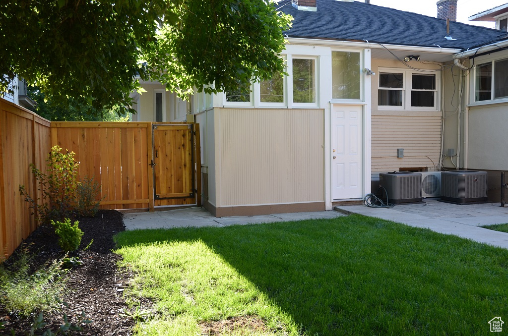 View of yard with central AC