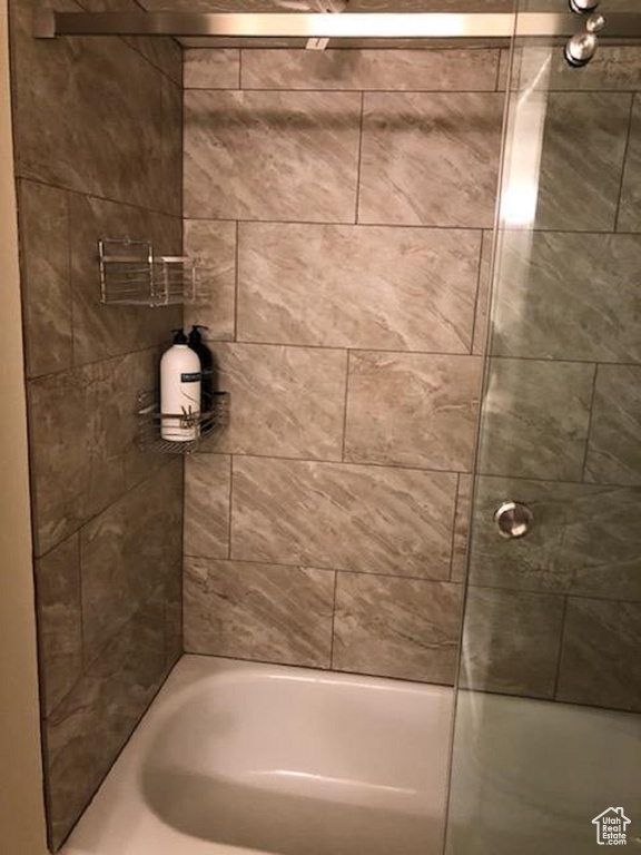 Full bathroom with shower / washtub combination