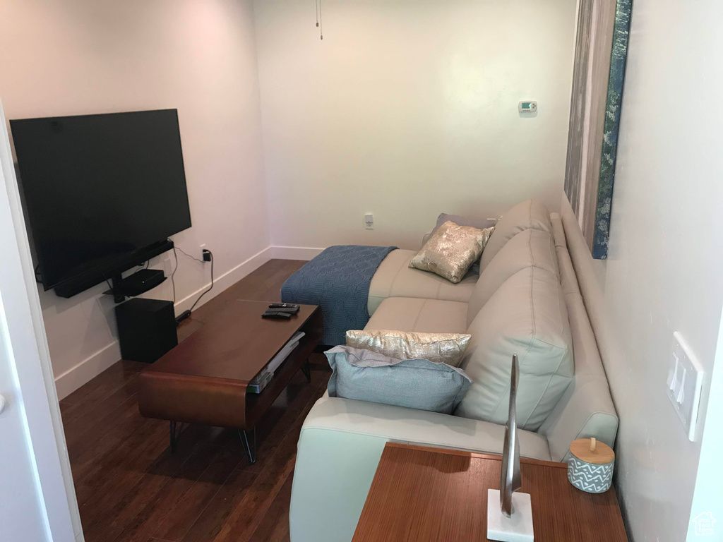 Living room featuring baseboards and wood finished floors