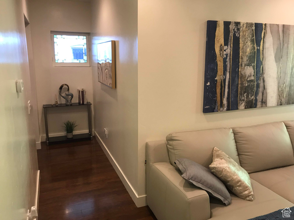 Hallway with wood finished floors and baseboards