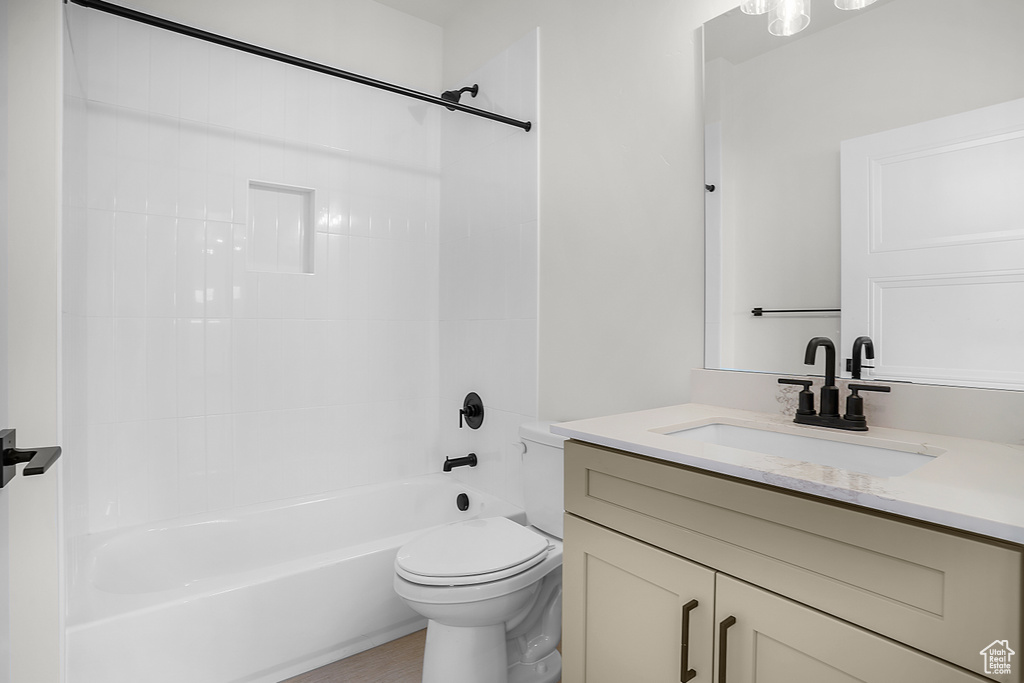 Full bath with vanity, toilet, and tub / shower combination