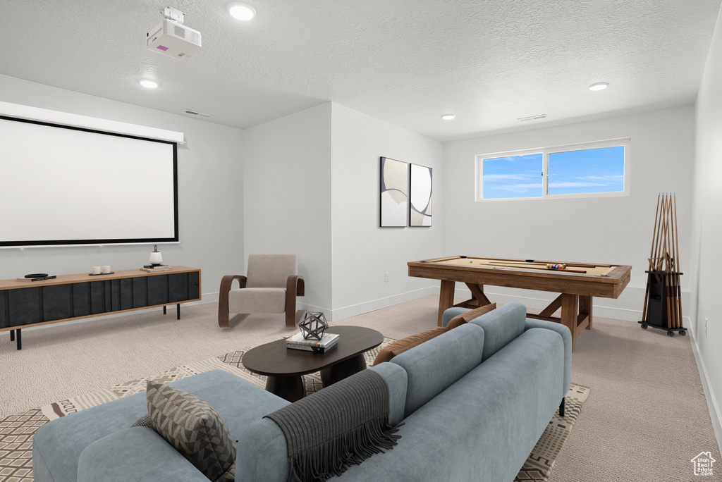 Home theater room with a textured ceiling, baseboards, recessed lighting, light carpet, and pool table