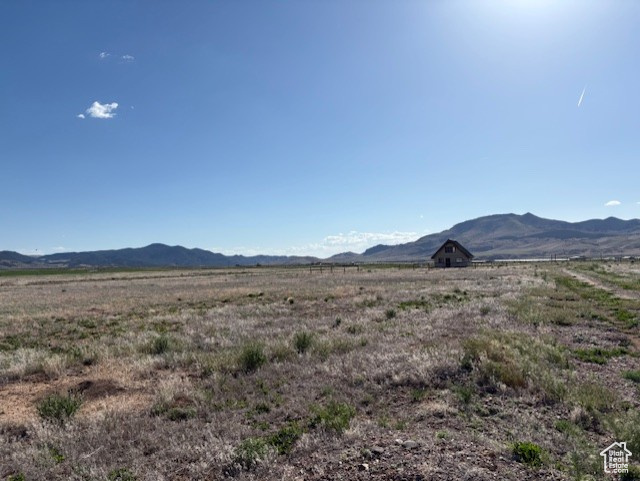 View of mountain background featuring rural landscape