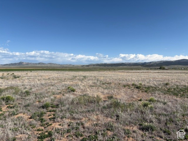 View of nature with rural landscape and a mountain backdrop