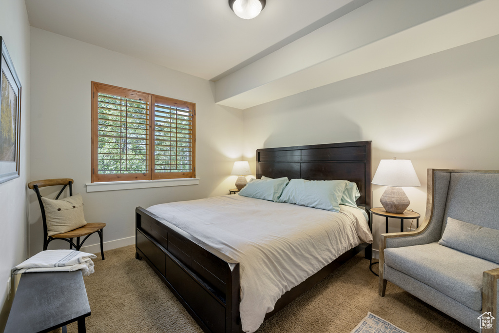 Carpeted bedroom with baseboards
