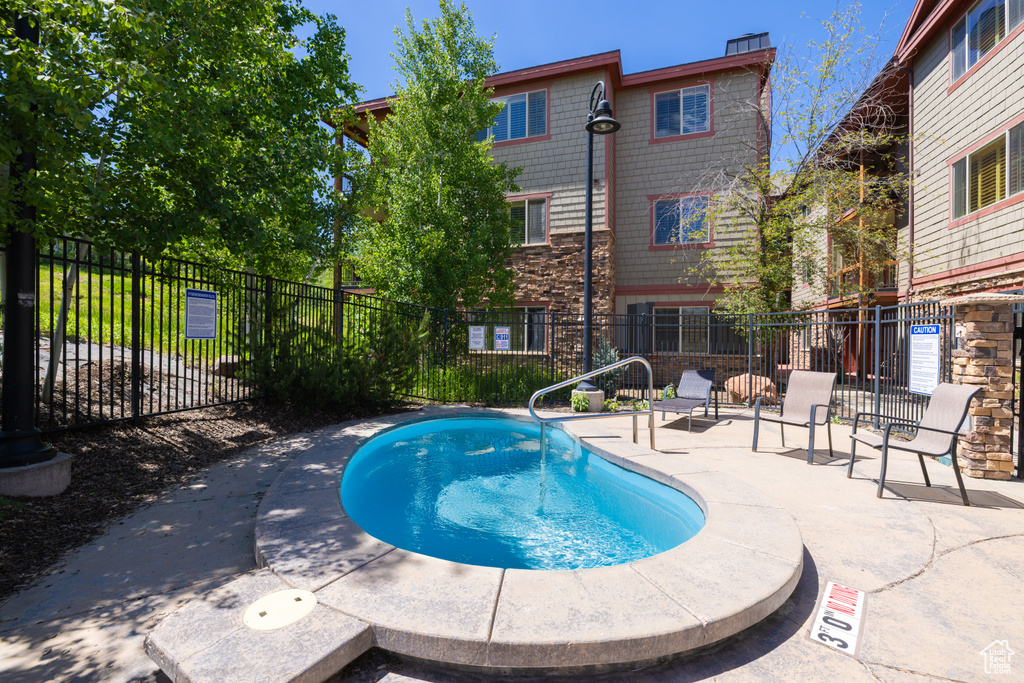View of swimming pool featuring a patio
