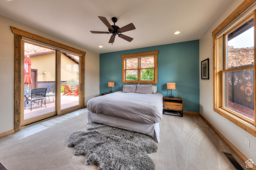 Carpeted bedroom with access to outside, multiple windows, recessed lighting, baseboards, and ceiling fan