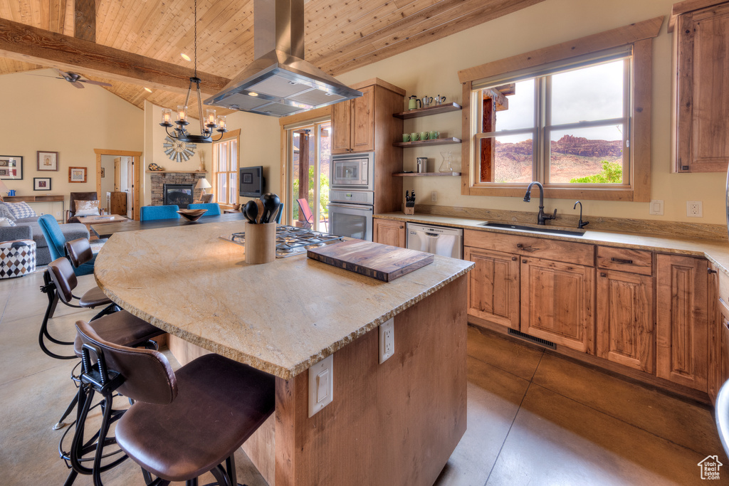 Kitchen featuring island exhaust hood, appliances with stainless steel finishes, wooden ceiling, a sink, and open floor plan