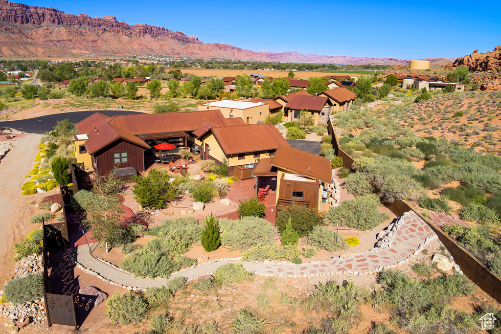 Birds eye view of property with a mountain view