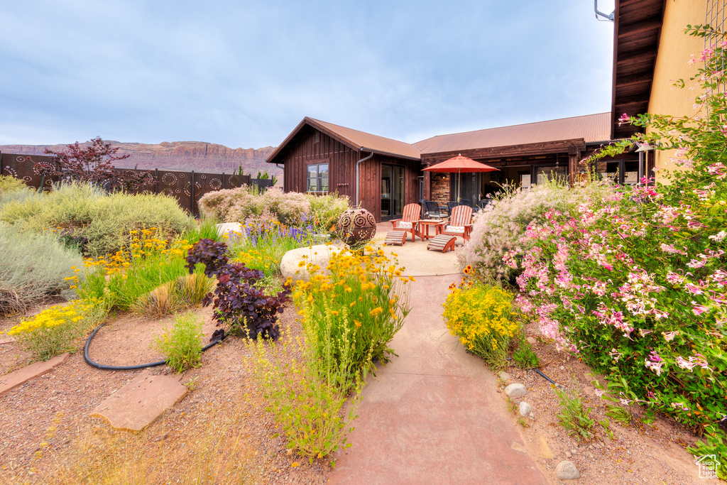 Back of property featuring a patio and board and batten siding
